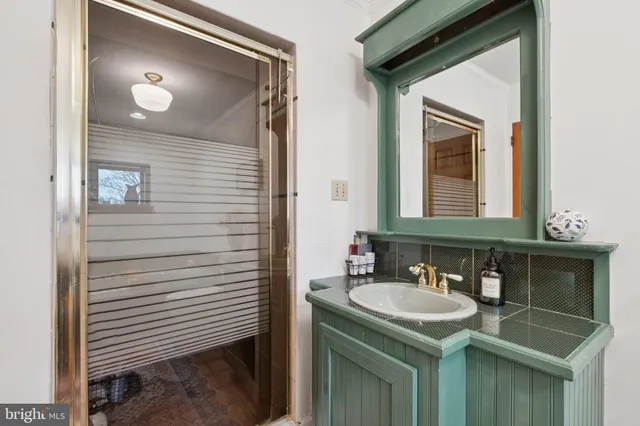 a bathroom with a sink and a mirror