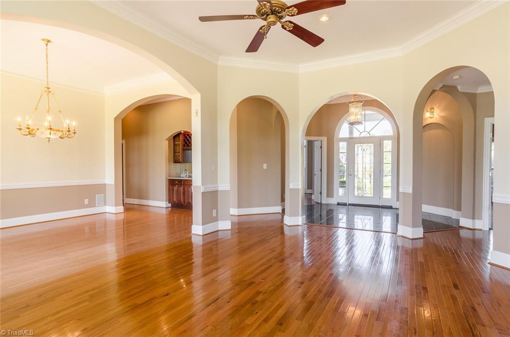 6702 Bugle Run Drive Oak Ridge, NC 27310 - Photo 3 of 29 Living Room and Dining Room with Wet Bar