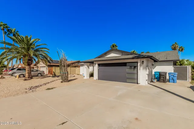 a view of a house with a snow in the background