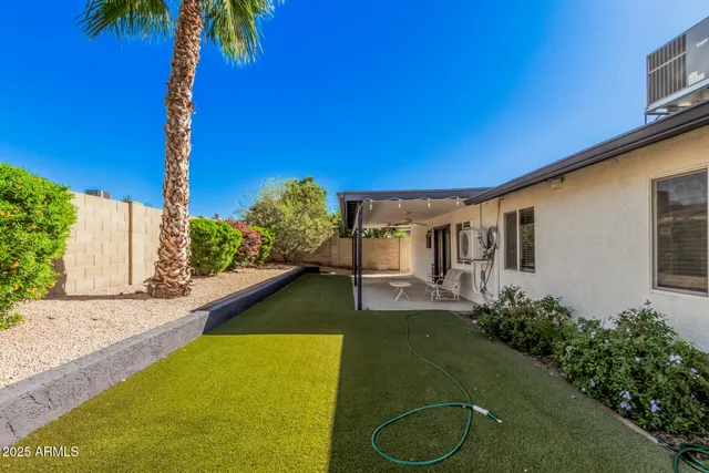 a house with swimming pool in front of it
