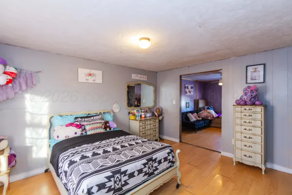 a bedroom with a bed and furniture