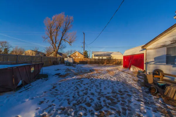 a backyard of a house with seating space