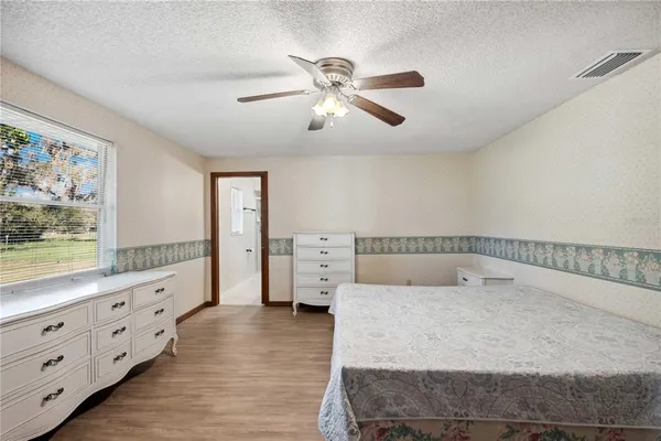 a bedroom with a bed and window