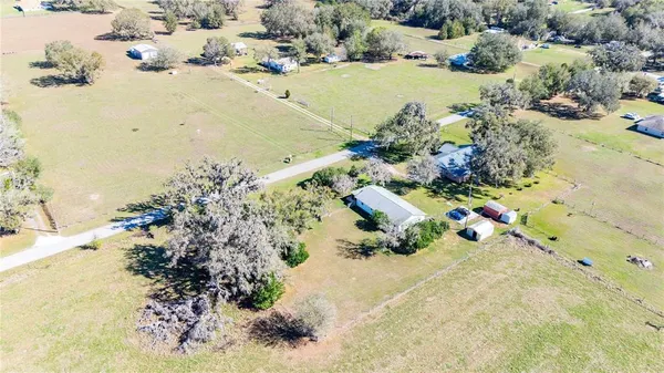 a aerial view of a house with a lake view