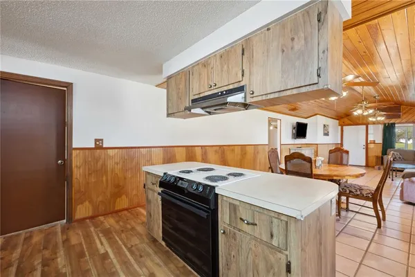 a kitchen that has a stove and a microwave oven