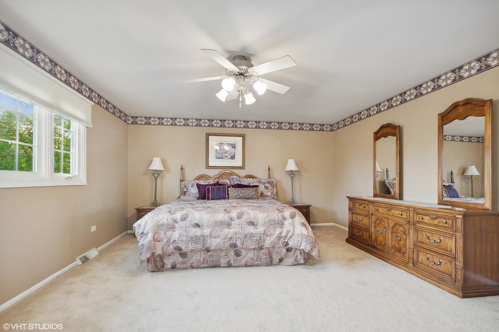 8669 Raintree Lane Orland Park, IL 60462 - Photo 15 of 25 a bedroom with a large bed and a chandelier