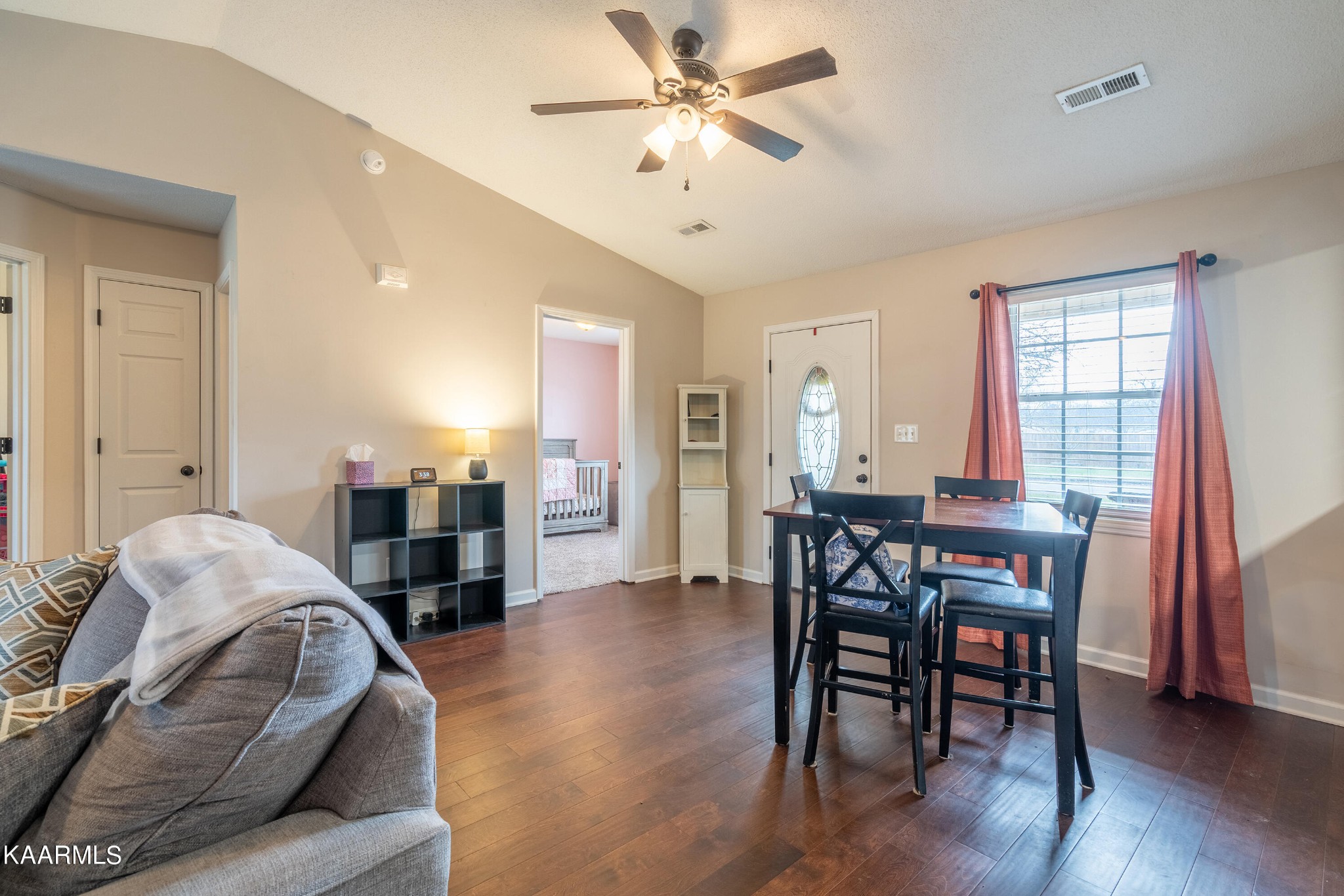 6408 Wilmouth Run Road Knoxville, TN 37918 - Photo 11 of 29 a living room with furniture and a dining table