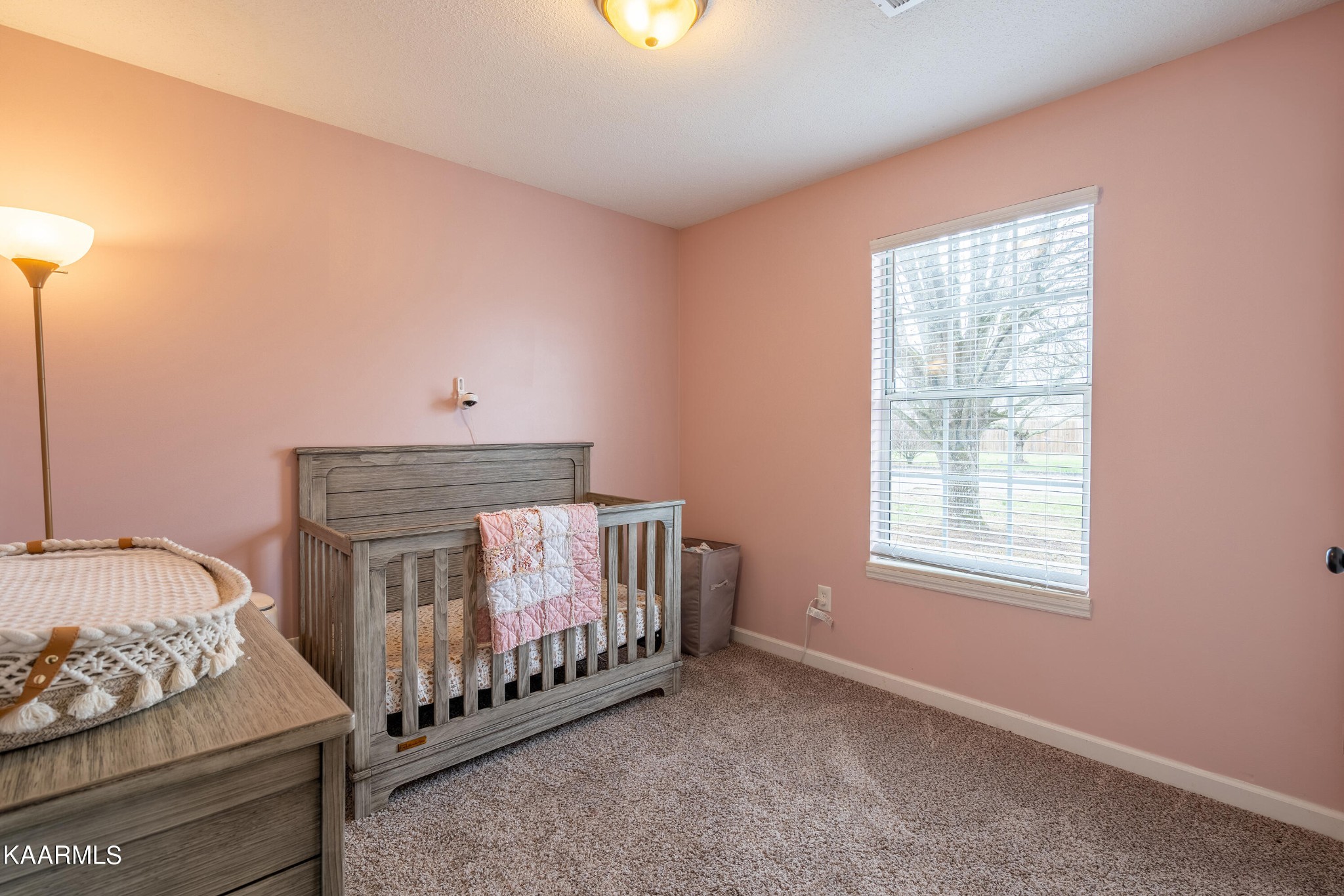6408 Wilmouth Run Road Knoxville, TN 37918 - Photo 14 of 29 a bedroom with furniture and a window