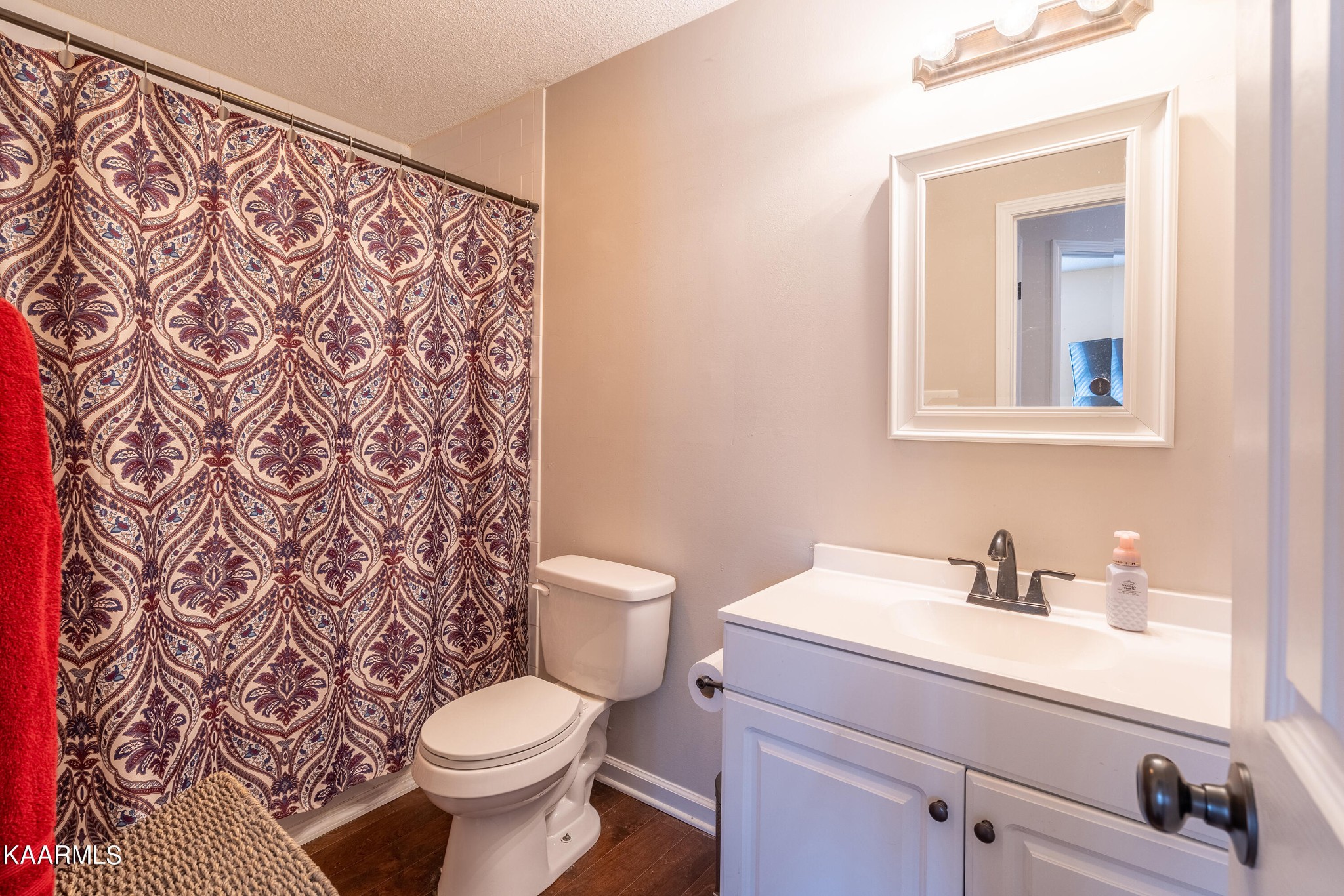 6408 Wilmouth Run Road Knoxville, TN 37918 - Photo 16 of 29 a bathroom with a toilet sink and mirror