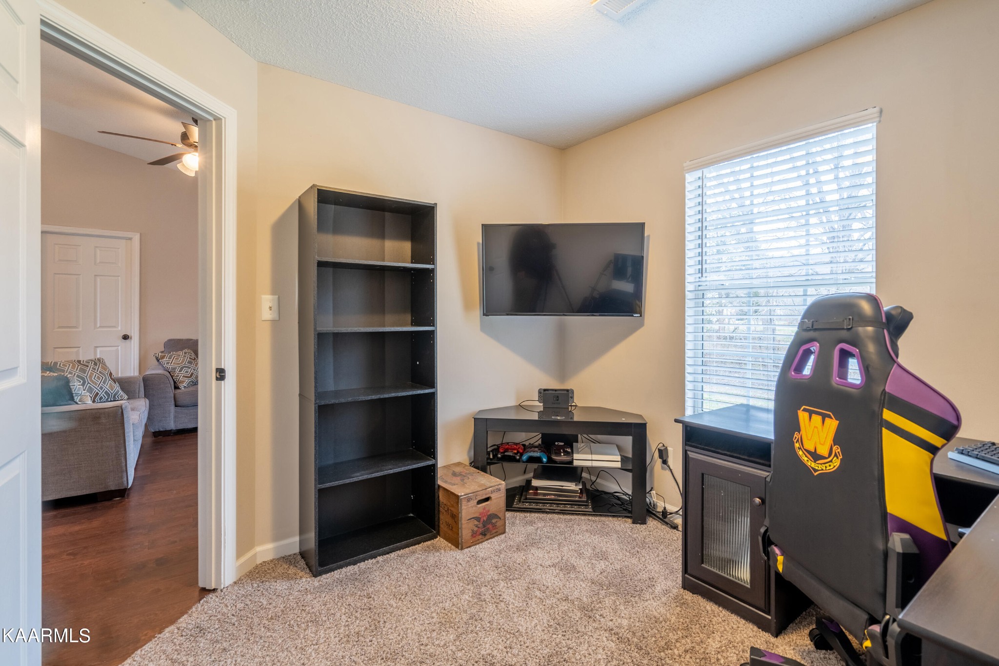 6408 Wilmouth Run Road Knoxville, TN 37918 - Photo 19 of 29 a living room with furniture and a flat screen tv