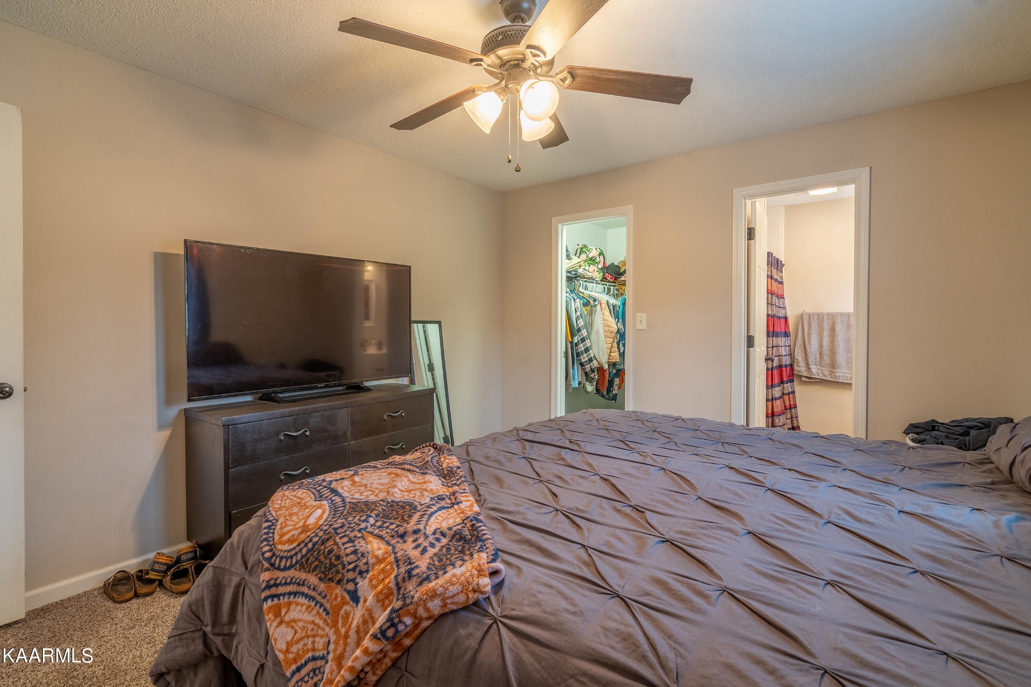 6408 Wilmouth Run Road Knoxville, TN 37918 - Photo 23 of 29 a bedroom with a bed and a flat screen tv
