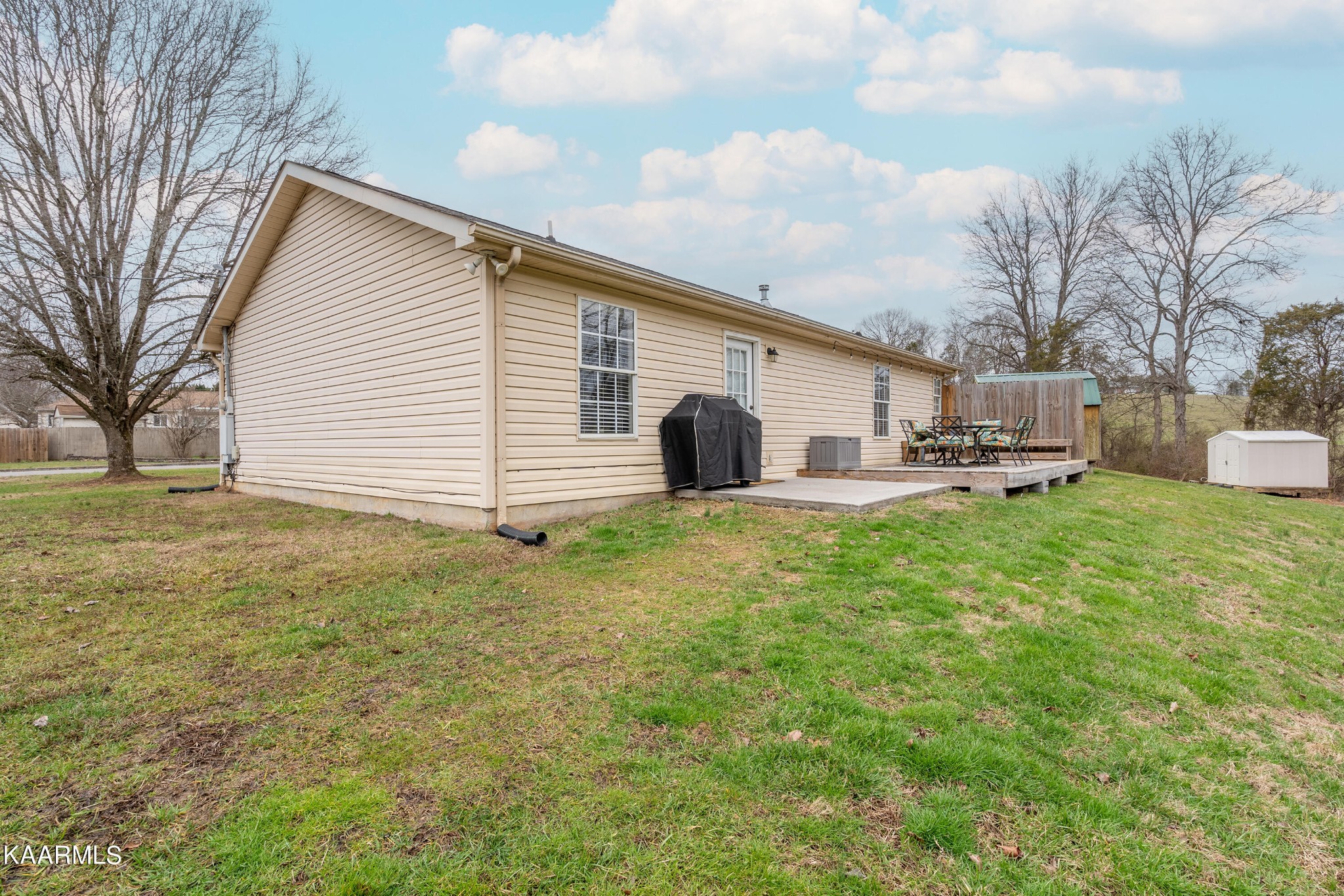 6408 Wilmouth Run Road Knoxville, TN 37918 - Photo 24 of 29 a front view of a house with a yard