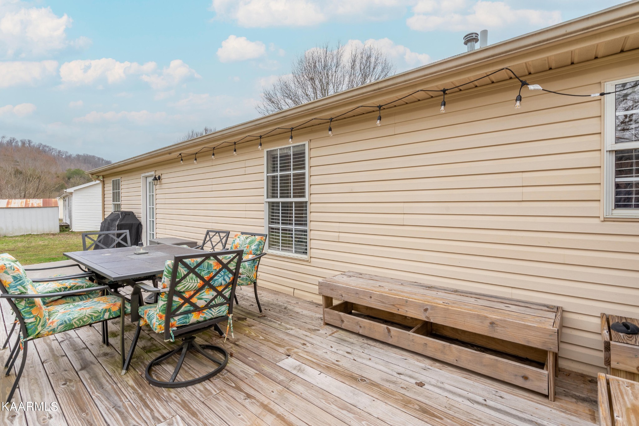 6408 Wilmouth Run Road Knoxville, TN 37918 - Photo 26 of 29 a view of a chairs and table on the deck