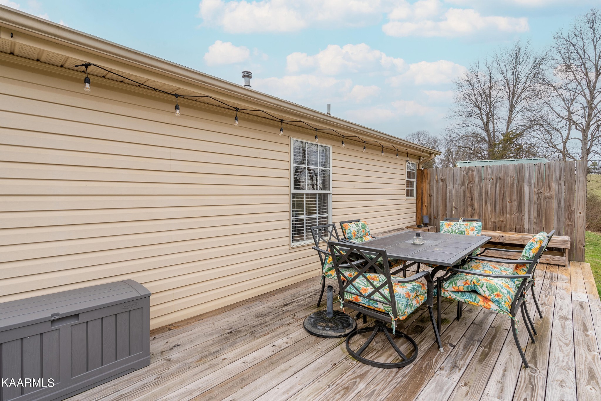 6408 Wilmouth Run Road Knoxville, TN 37918 - Photo 27 of 29 a view of a roof deck with table and chairs and wooden floor