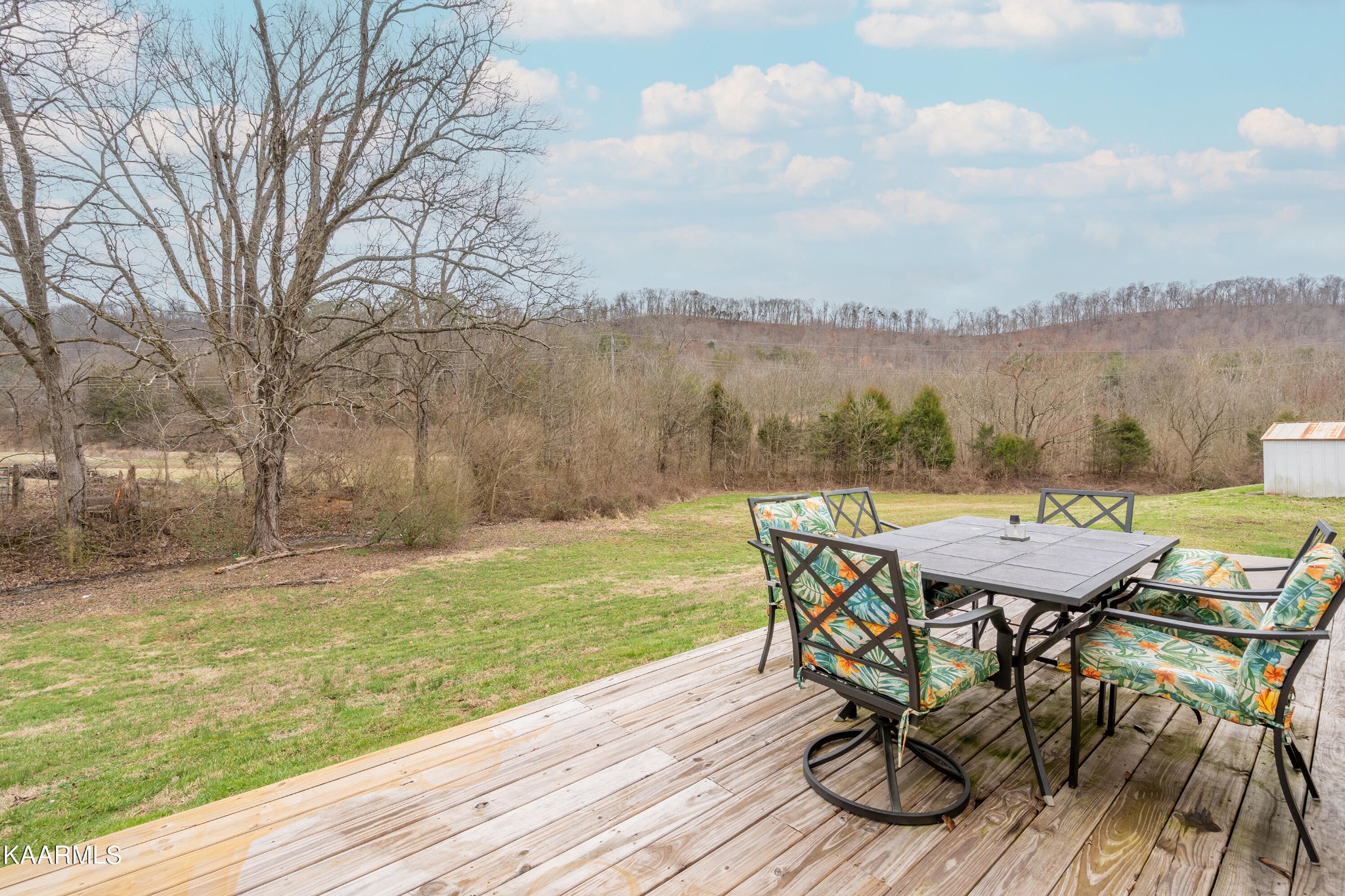 6408 Wilmouth Run Road Knoxville, TN 37918 - Photo 28 of 29 a view of a lake with table and chairs