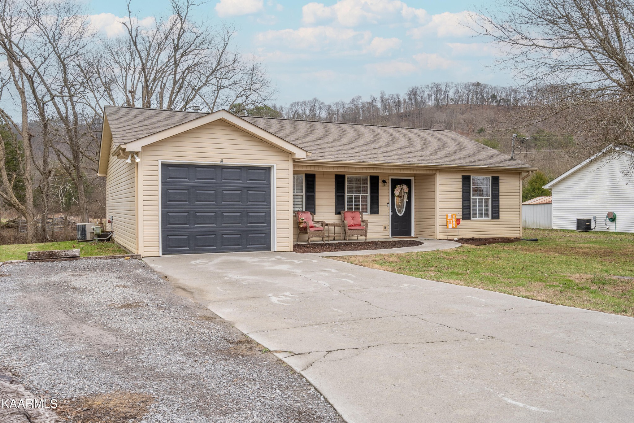 6408 Wilmouth Run Road Knoxville, TN 37918 - Photo 3 of 29 a view of a house with basketball court