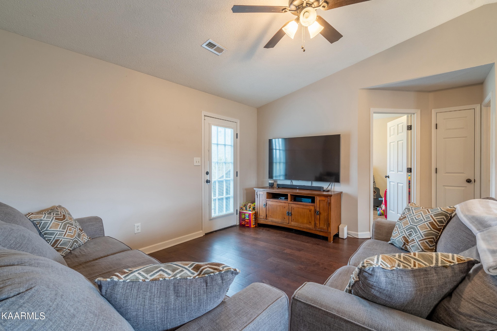 6408 Wilmouth Run Road Knoxville, TN 37918 - Photo 8 of 29 a living room with furniture and a flat screen tv