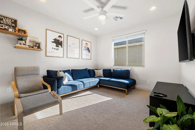 a living room with furniture and a window