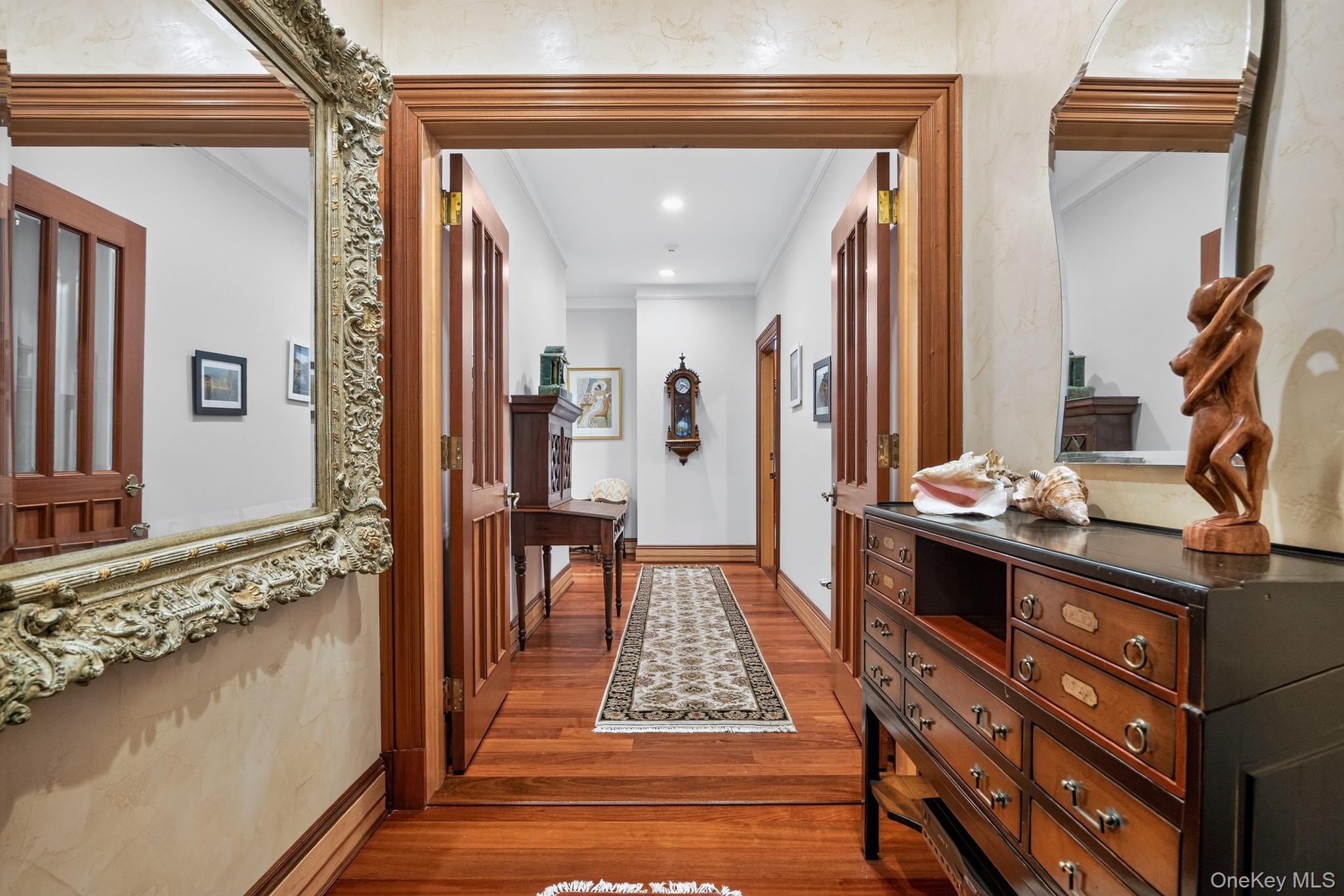 23 Inningwood Road Ossining, NY 10562 - Photo 39 of 50 Entryway featuring wood-finish flooring, paneled wood doors, and decorative wall molding