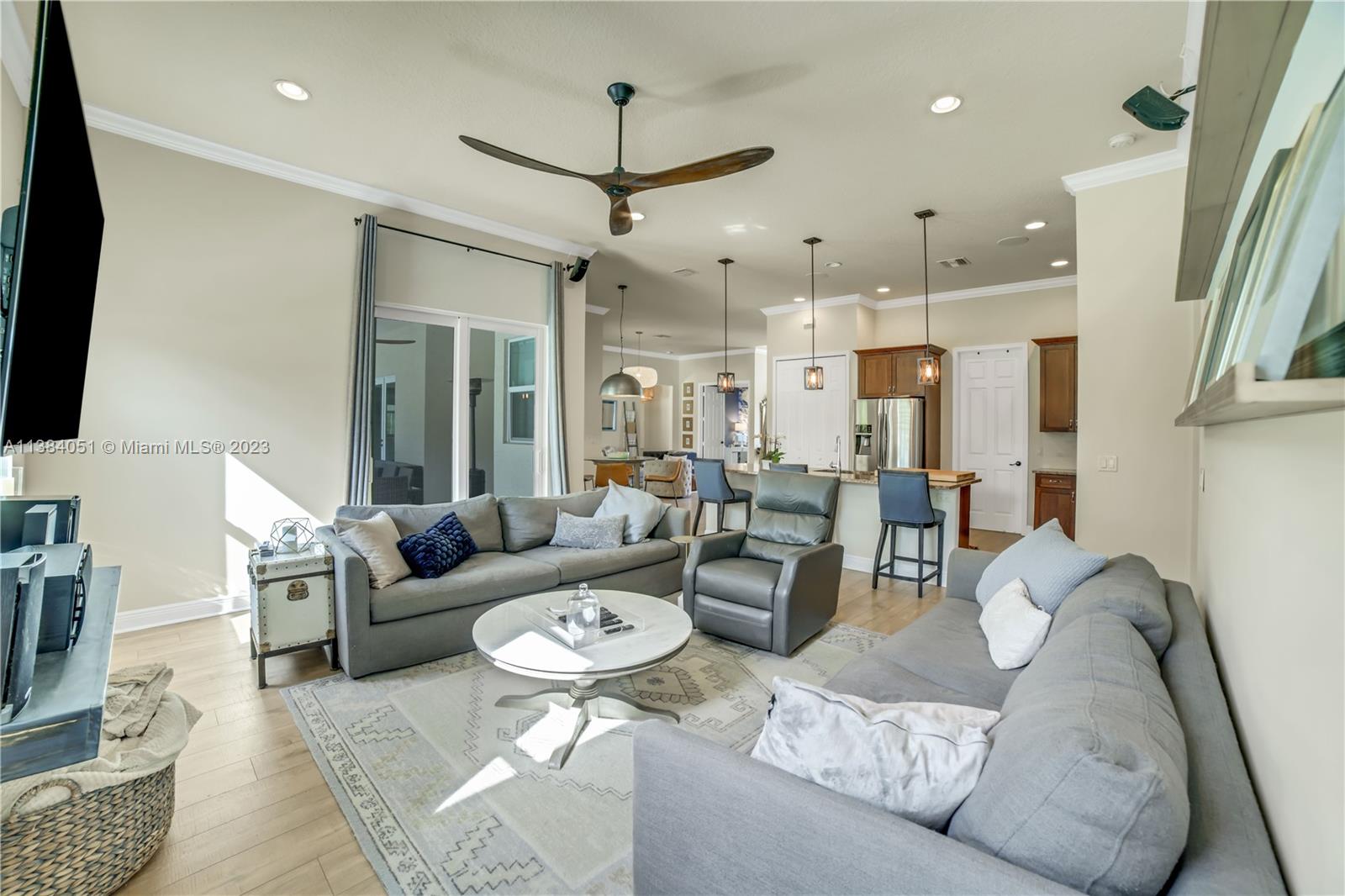 15833 Alexander Run Jupiter, FL 33478 - Photo 17 of 39 a living room with furniture and a flat screen tv