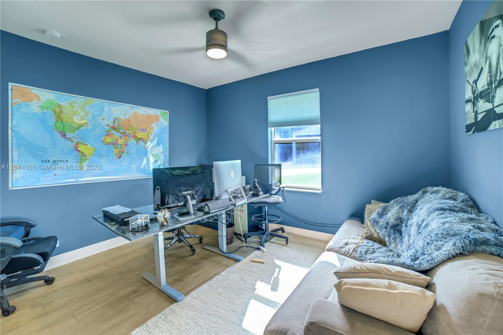 15833 Alexander Run Jupiter, FL 33478 - Photo 19 of 39 a living room with furniture and a wooden floor