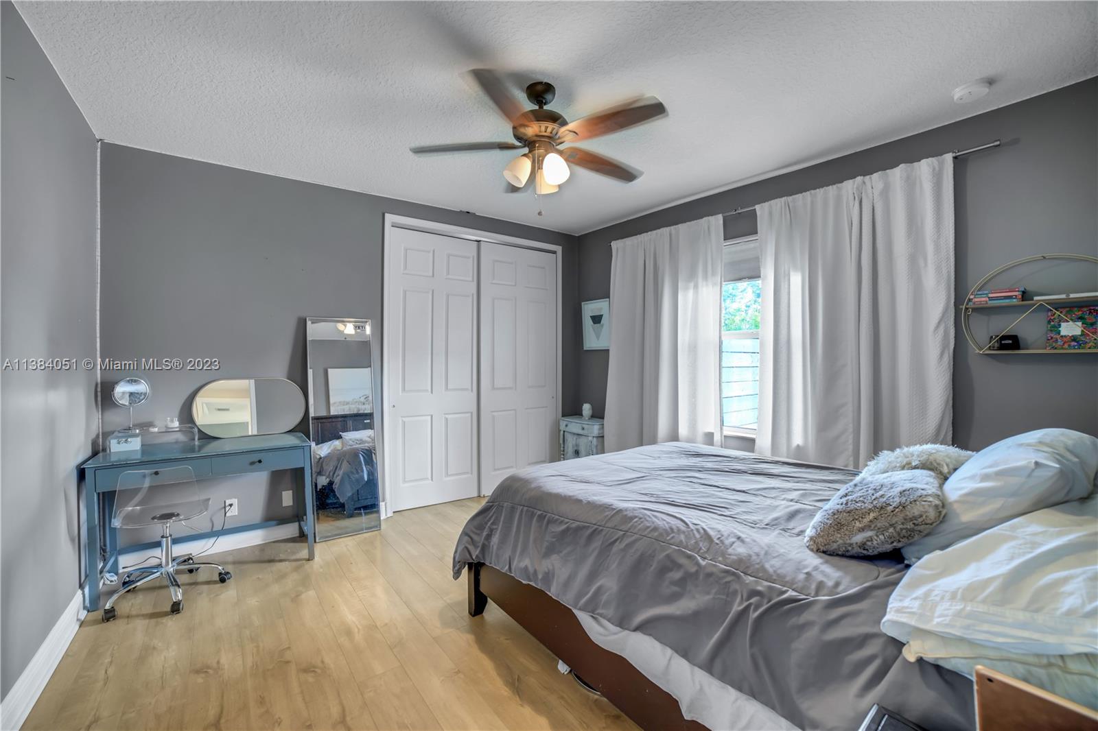 15833 Alexander Run Jupiter, FL 33478 - Photo 21 of 39 a bedroom with a bed and window
