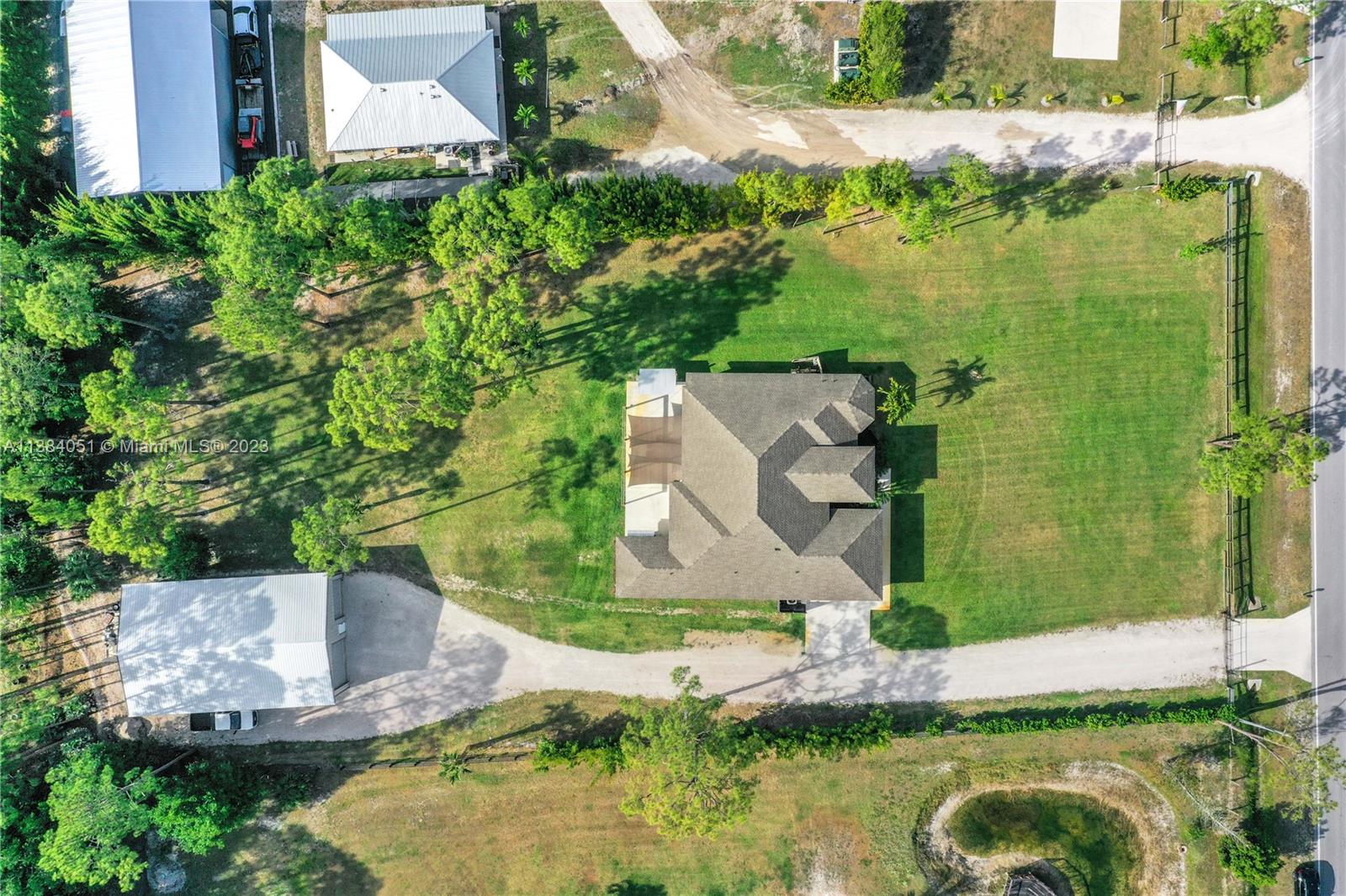 15833 Alexander Run Jupiter, FL 33478 - Photo 30 of 39 an aerial view of a house with a yard basket ball court and outdoor seating