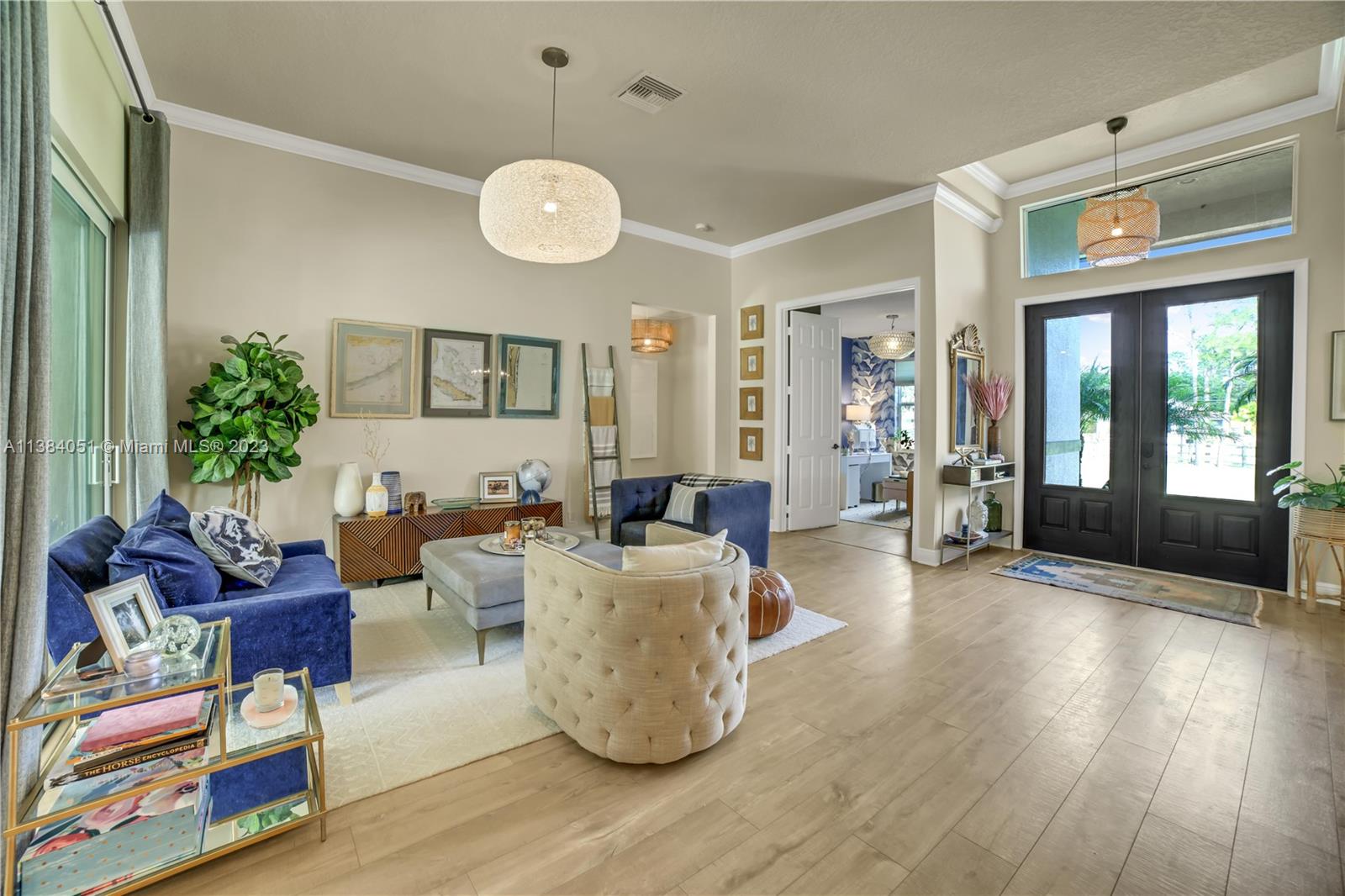 15833 Alexander Run Jupiter, FL 33478 - Photo 3 of 39 a living room with furniture window and wooden floor