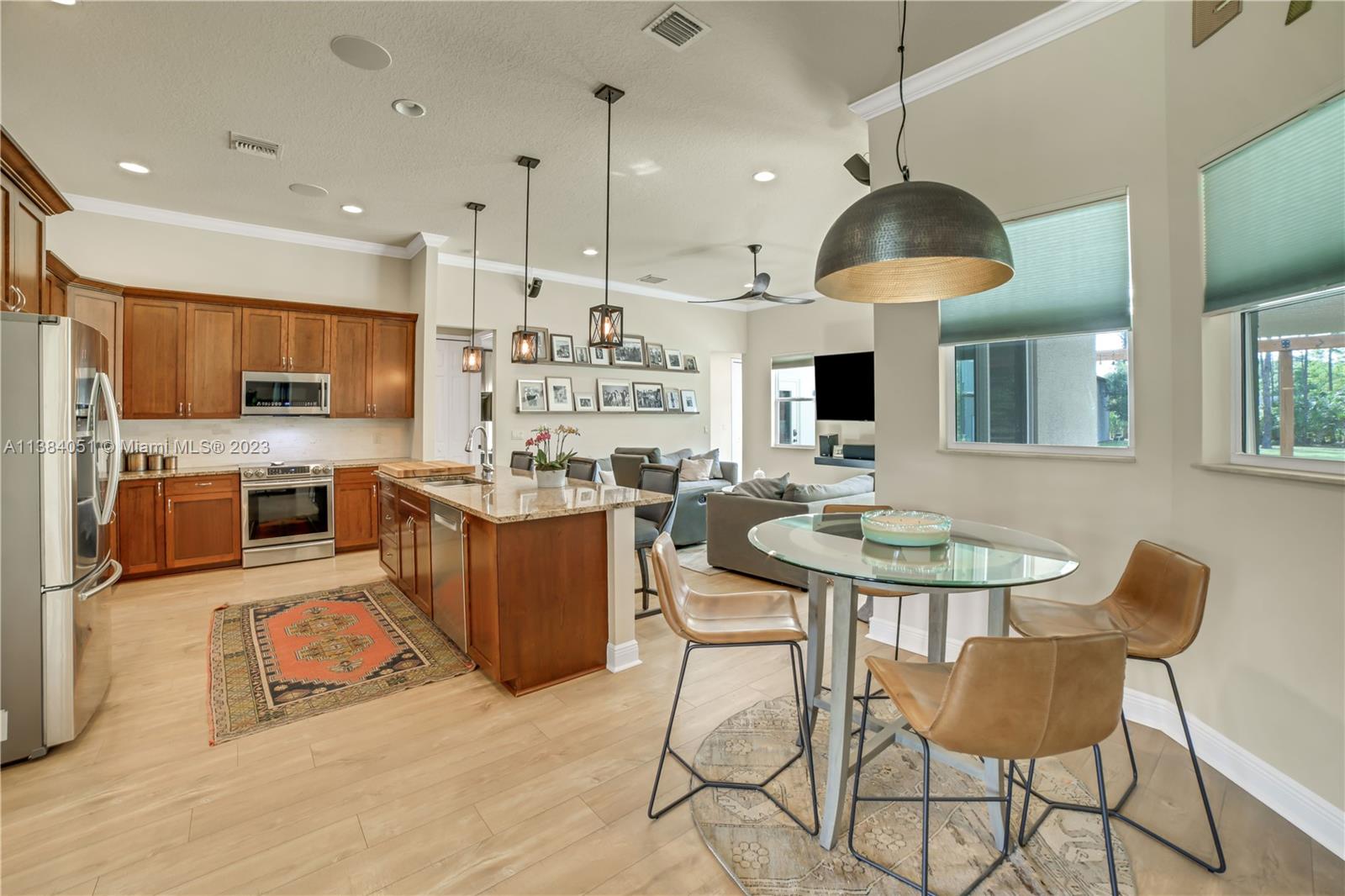 15833 Alexander Run Jupiter, FL 33478 - Photo 7 of 39 a kitchen with a table and chairs in it