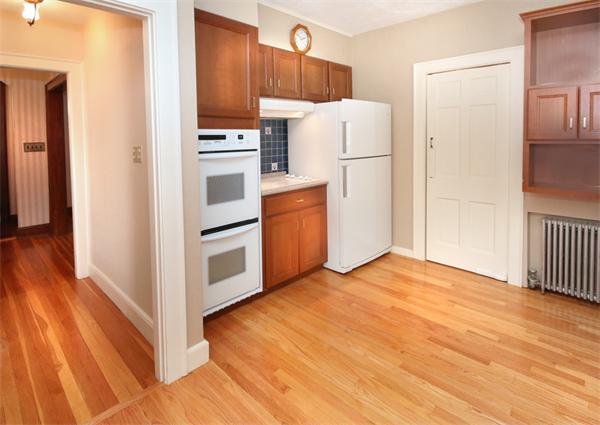 37 Bogandale Road Boston, MA 02132 - Photo 11 of 25 a kitchen with a refrigerator and a stove