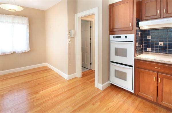 37 Bogandale Road Boston, MA 02132 - Photo 12 of 25 a view of a kitchen with wooden floor and electronic appliances