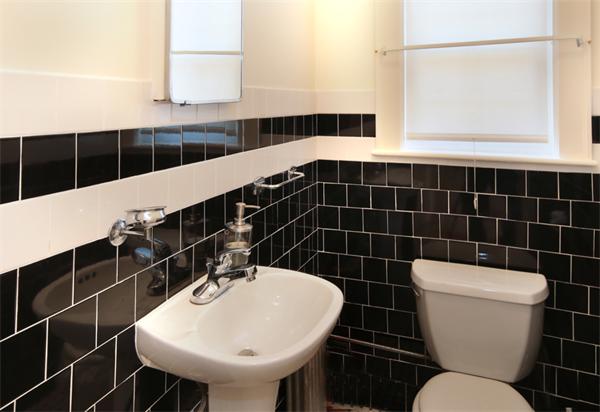 37 Bogandale Road Boston, MA 02132 - Photo 13 of 25 a bathroom with a toilet a sink and a mirror