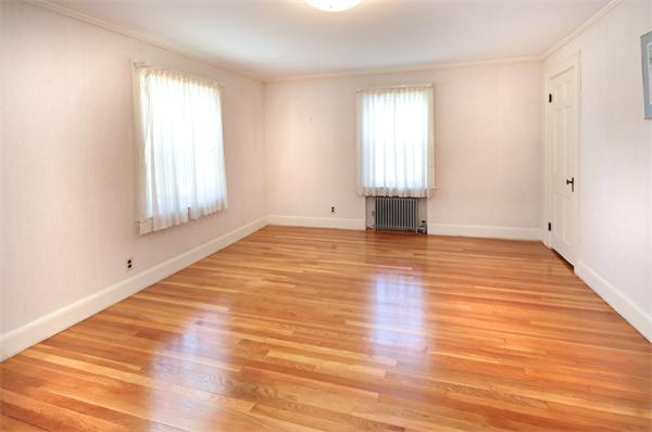 37 Bogandale Road Boston, MA 02132 - Photo 18 of 25 an empty room with wooden floor and windows