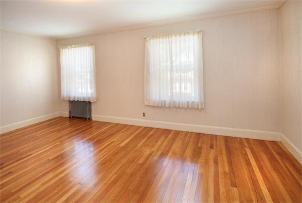 37 Bogandale Road Boston, MA 02132 - Photo 19 of 25 an empty room with wooden floor and windows