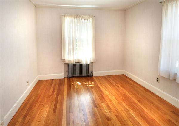 37 Bogandale Road Boston, MA 02132 - Photo 20 of 25 a view of empty room with wooden floor and fan