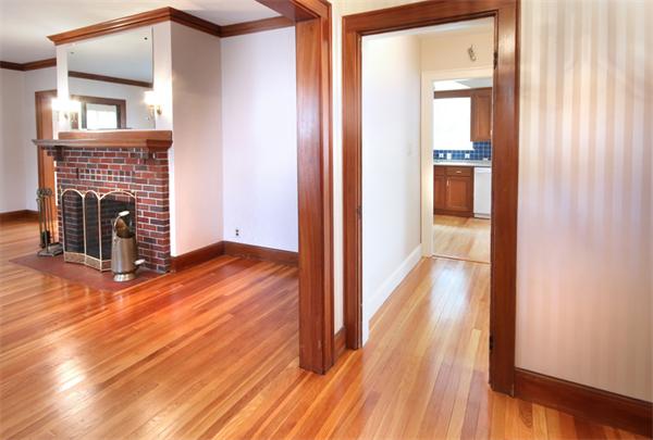 37 Bogandale Road Boston, MA 02132 - Photo 3 of 25 a view of a livingroom with wooden floor and a fireplace