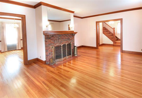 37 Bogandale Road Boston, MA 02132 - Photo 5 of 25 a view of an empty room with wooden floor and a window