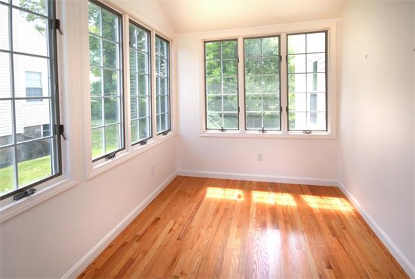 37 Bogandale Road Boston, MA 02132 - Photo 7 of 25 a view of an empty room with wooden floor and a window