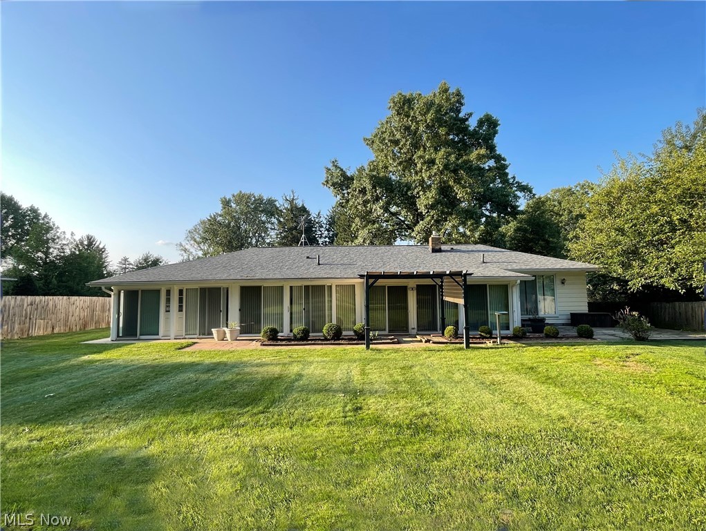 686 Shook Road Akron, OH 44319 - Photo 18 of 22 A fantastic view of the expansive rear yard, showing the three enclosed rooms at the rear of the home.