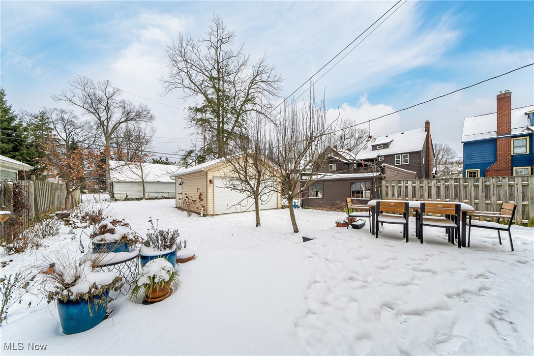 3733 Montevista Road Cleveland, OH 44121 - Photo 29 of 35 Snowy yard with an outbuilding and a garage