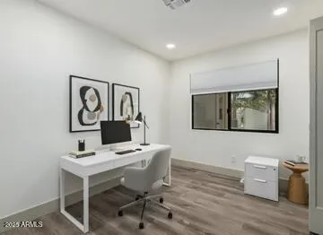 a workspace with furniture and wooden floor