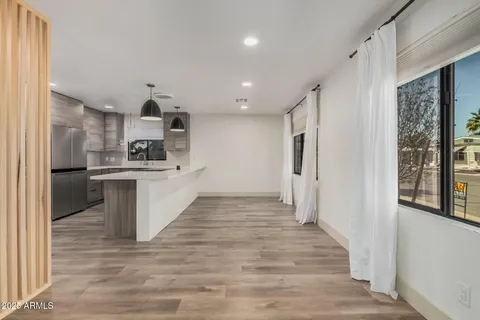 a kitchen with stainless steel appliances a refrigerator and a sink