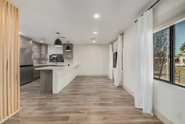 a kitchen with stainless steel appliances a refrigerator and a sink
