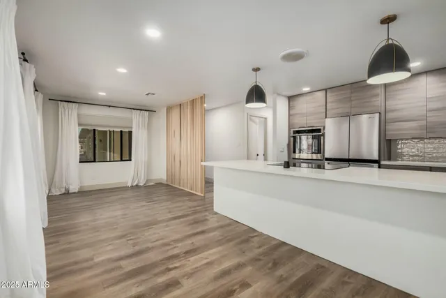 a view of a kitchen with sink and cabinet area