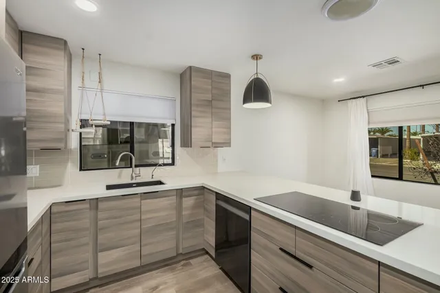 a kitchen with a sink and cabinets