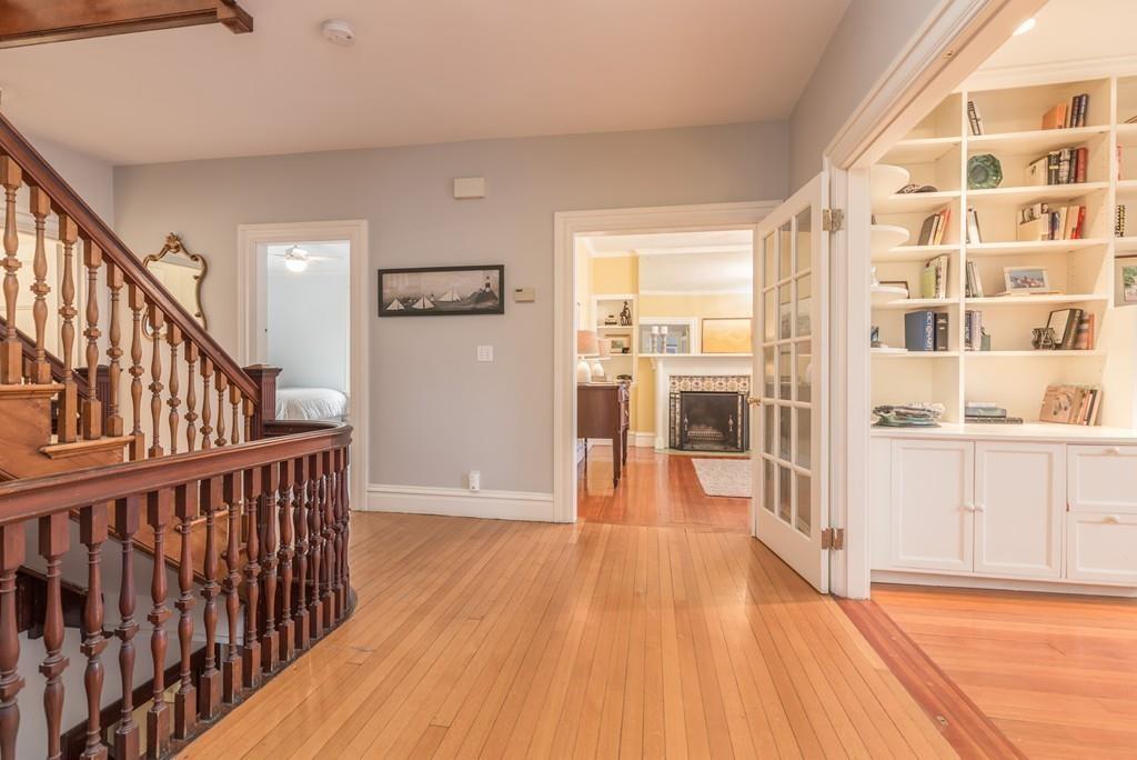 33 Naples Road Brookline, MA 02446 - Photo 15 of 31 a view of a hallway with wooden floor and windows