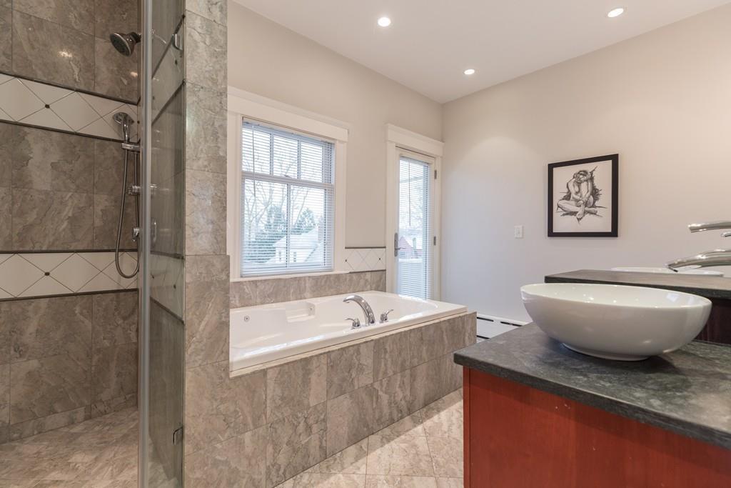 33 Naples Road Brookline, MA 02446 - Photo 20 of 31 a bath room with a toilet and a bath tub