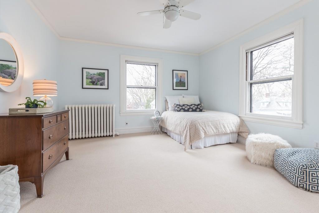 33 Naples Road Brookline, MA 02446 - Photo 21 of 31 a spacious bedroom with a bed and a window