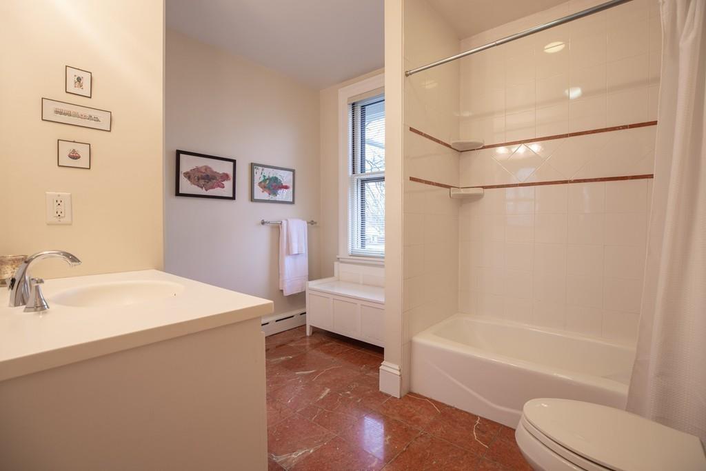33 Naples Road Brookline, MA 02446 - Photo 22 of 31 a bathroom with a sink a toilet and a bathtub