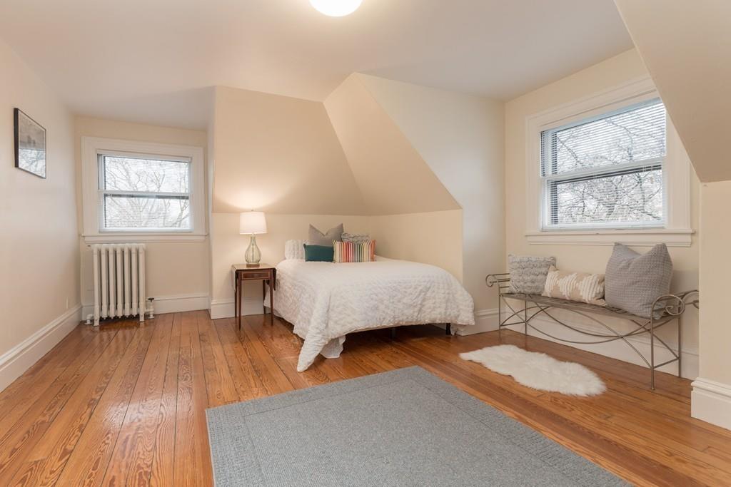 33 Naples Road Brookline, MA 02446 - Photo 24 of 31 a bedroom with a bed and a window